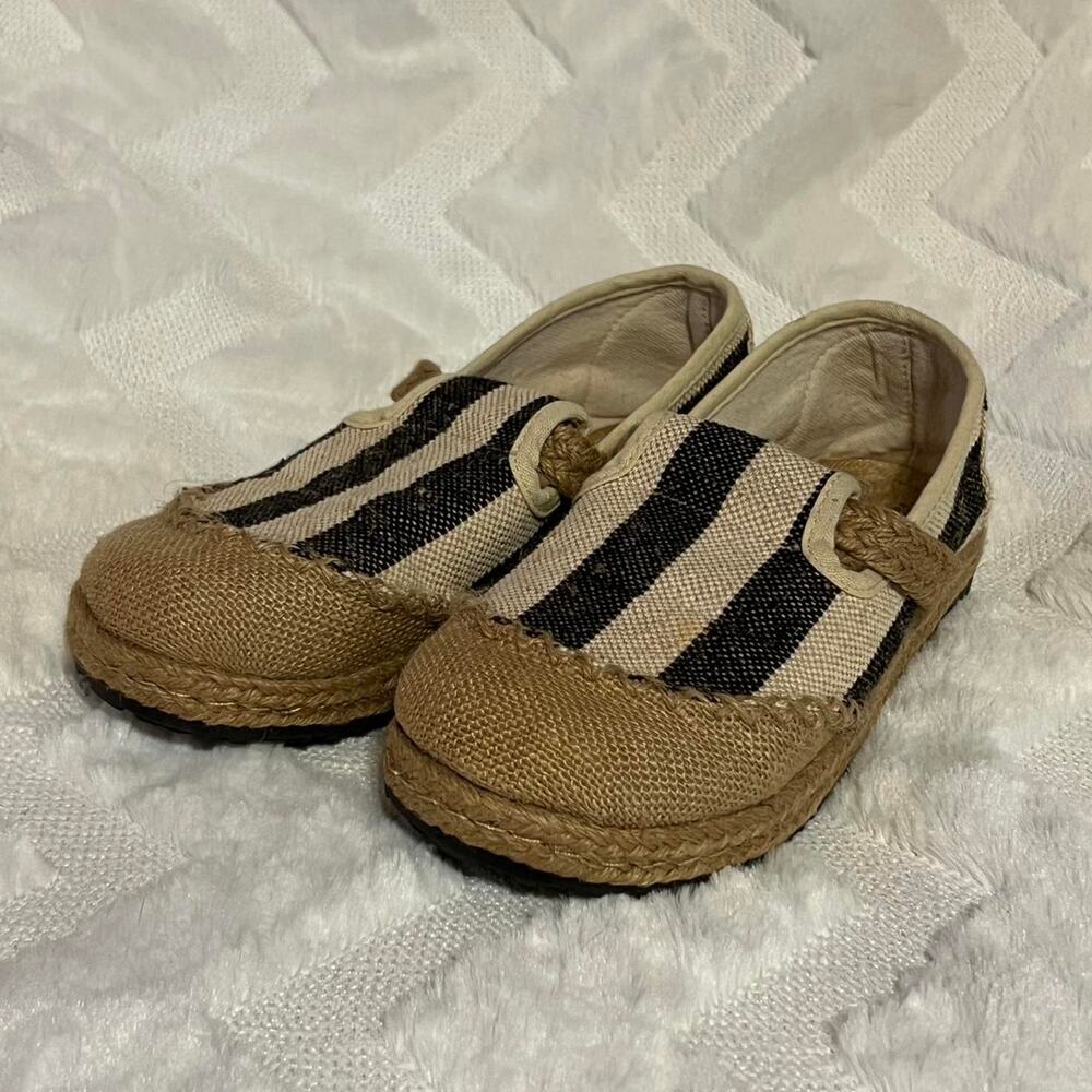Black and tan striped slip-on shoes